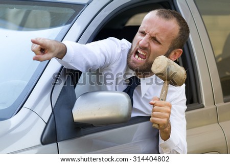 Stressed and furious driver in his car