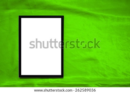 Mock up poster on satin material. background abstract cloth of wavy folds of silk texture satin or velvet material or  wallpaper design of elegant curves material. Plastic frame on a satin material