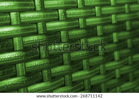 Color synthetic rattan texture weaving background. Closeup of synthetic rattan weave texture as used on outdoor garden furniture . Modern colors. Useful as background or texture