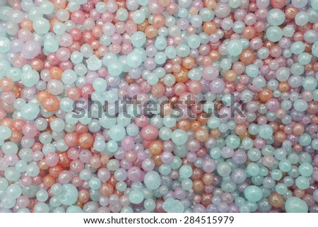 colorful little pearls background or texture . Small beads background