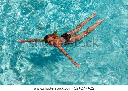 The woman swims in the sea