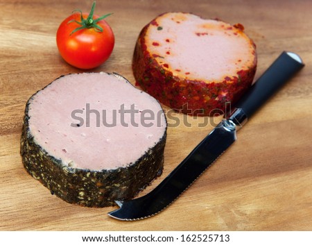 Two meat pastes, special knife and tomato