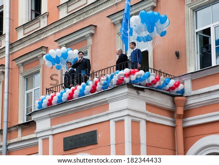SAINT PETRSBURG - SEPTEMBER 1: The director congratulates school students on the beginning of academic year on September 1, 2011 in Saint-Petersburg, Russia.