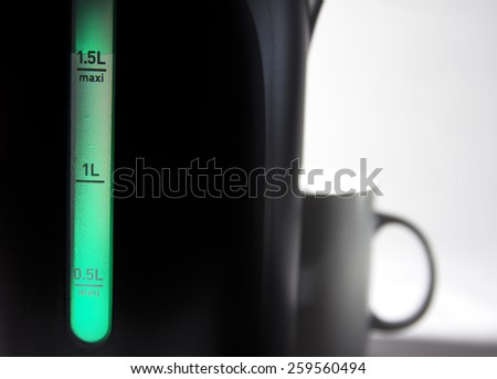 Measured mark water level of the electric kettle, green color - goes process of boiling