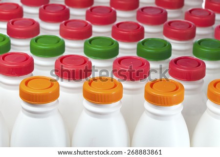 dairy products bottles with bright covers