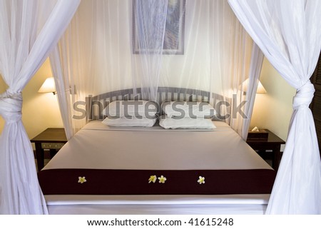 Wide bed under bed curtains