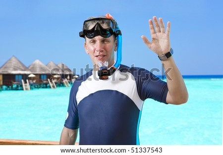 Man stands with equipment for Snorkel,