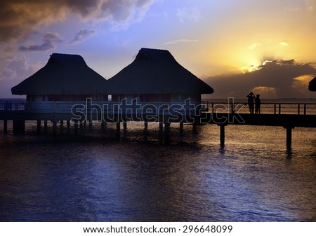 Island in ocean, Maldives.  Sunset.