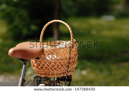 tail part of female bicycle with strow basket