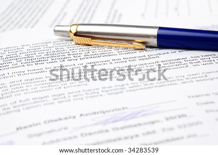 closeup photo of signature the document