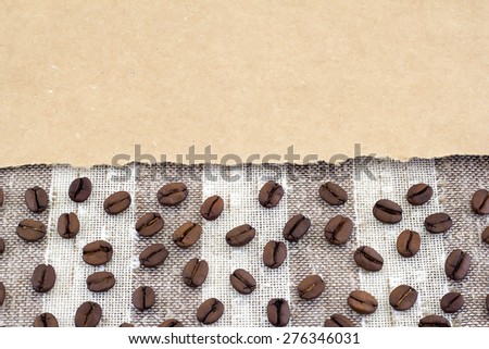 Coffee beans, ripped brown paper and fabric.