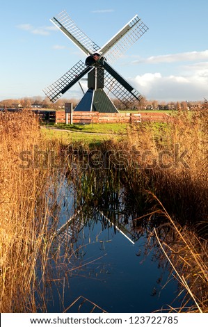Old spider head mill used as a polder mill, standing in the North of the Netherlands, in the province of Friesland