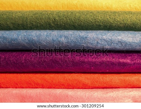 Felt of different colors, folded on each other, forming a colored line
