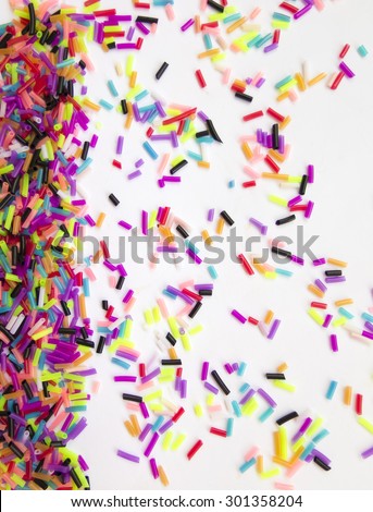 Colorful, fun background of colorful small pieces\
Festive colorful confetti on white background