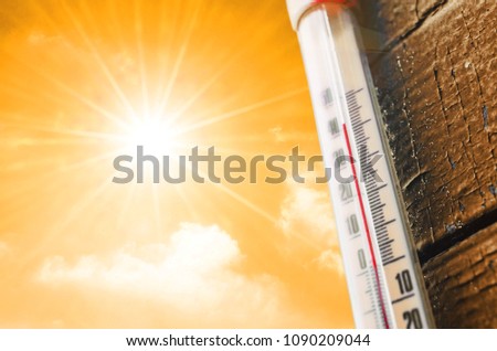 Thermometer is hot in the sky, concept of hot weather