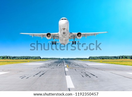 Airplane aircraft flying departure after flight, landing on a runway in the good weather clear sky day