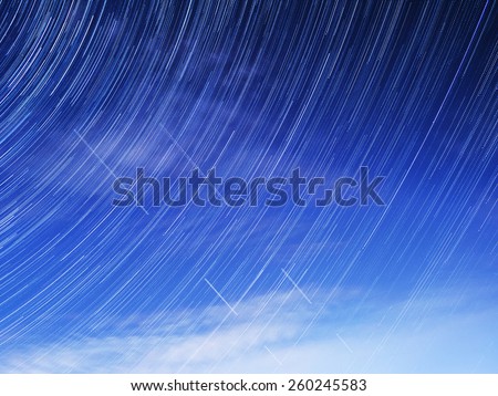 Startrails star lights the night sky plane satellite space universe earth clouds