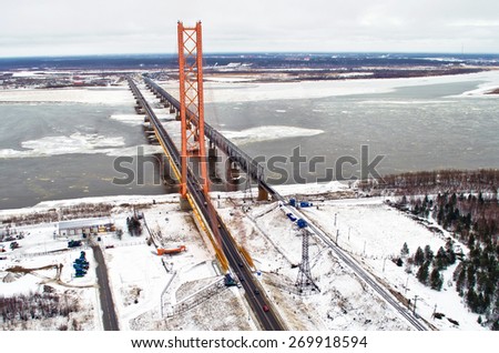 The longest cable-stayed bridge over the river ice snow winter Siberia spring