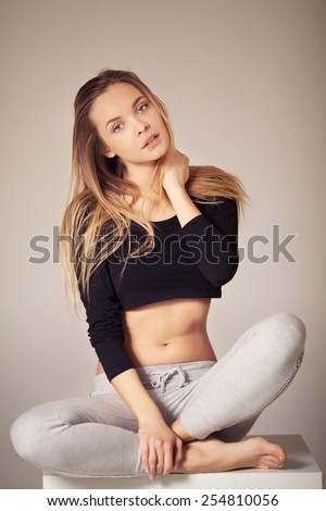 Portrait of beautiful young girl with natural blond hair posing without makeup.