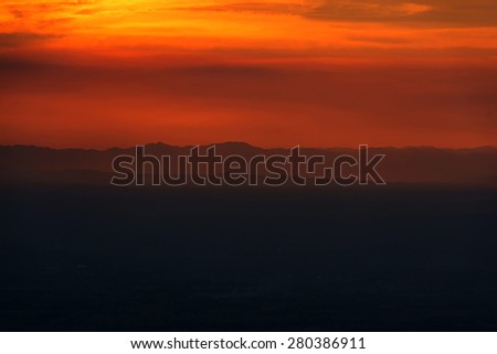 sunset in mountain have dark clouds and mist.