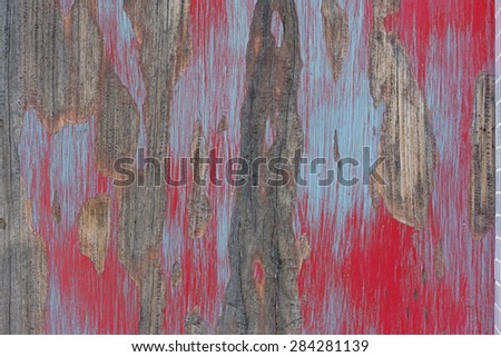 old wall wooden with red is stripping.