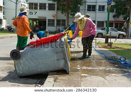 NONTHABURI THAILAND-MAY 26: women workers clean up trash in the village for good health of the people in the village may 26,2015 at Bangbourthong village Thailand