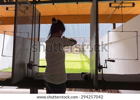 Women rifle shooting in the indoor Shooting Range.