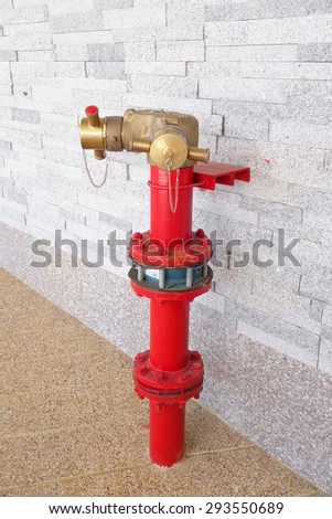 head fire hydrant near the wall