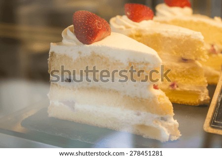 strawberry cake in grass cabinet
