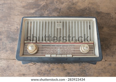 Vintage radio on old wood background
