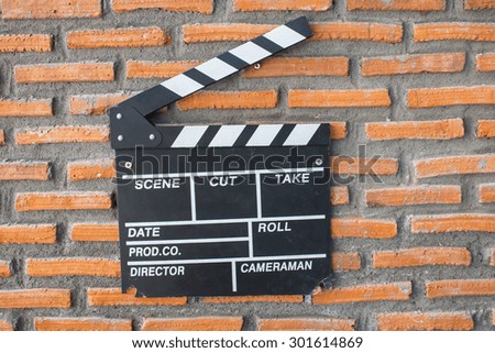 Film slate on brick background