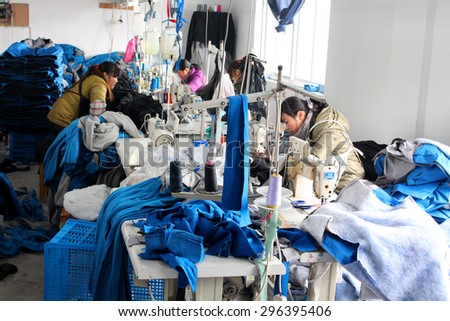 CHINA - JANUARY 15: Chinese clothes factory with seamstresses, January 15, 2013 in China