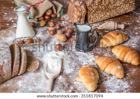 at the bakery, still life with mini Croissants, bread, milk, nuts and flour