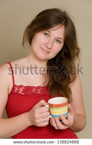 portrait of cute woman with mug