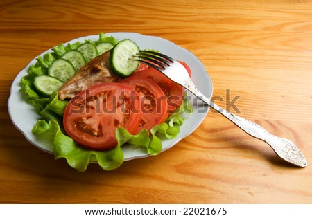 dish with piece of chicken and vegetables