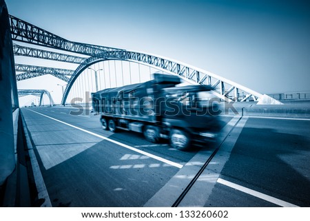highway and modern bridge of city,blue toned.