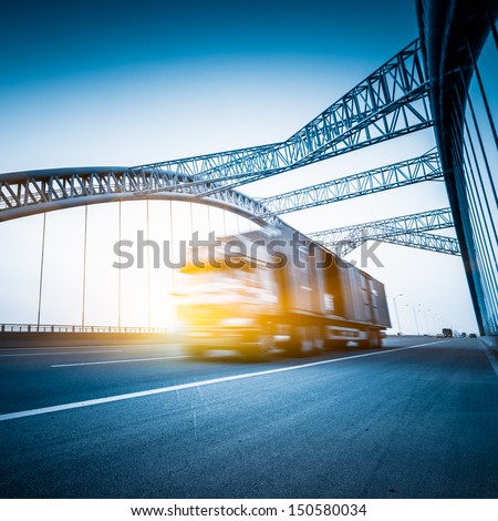 speeding truck go through the bridge.