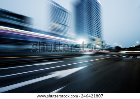 speeding lights of cars in city at night.