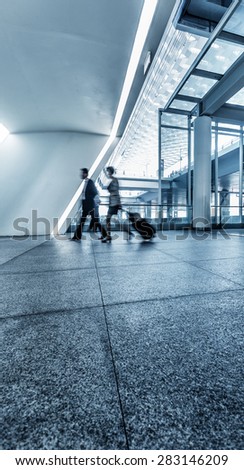 Airport terminal hall. Walking travelers at shanghai airport.