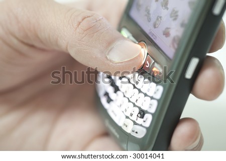 hand holding pda cell phone, concept of receiving email