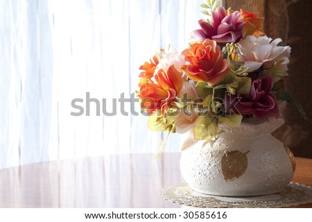 the flower at the window in natural lighting
