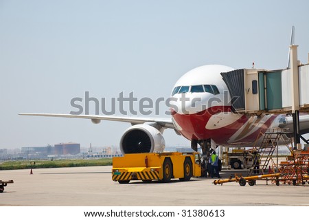 airplane is waiting for departure in pudong airport shanghai china.