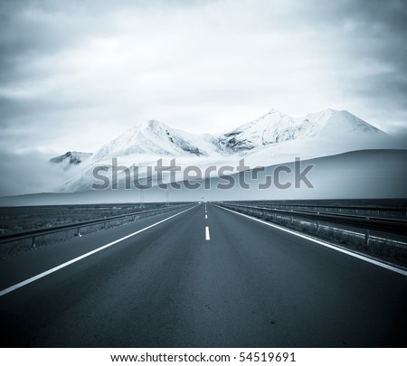 road to the future with the mountain and blue sky background outdoor.