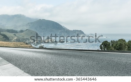 clean highway go aside the bay of ocean, california, usa.