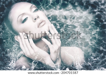 beauty female portrait with water drops and foam