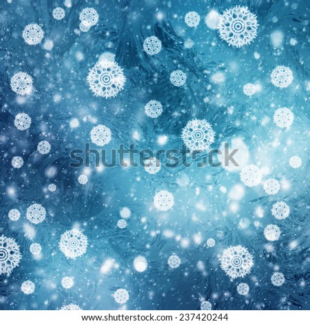 Abstract winter backgrounds with snow flakes over frozen blue texture