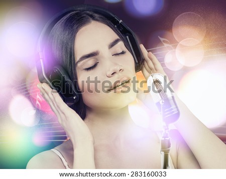 Beauty young girl hearing music with headset, female portrait