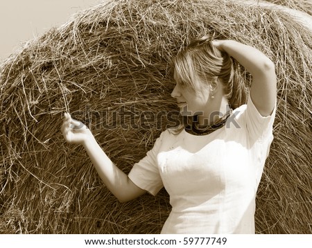 Country view. pretty adult woman portrait on the field