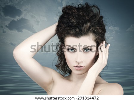 Beauty female portrait against marine soft background. Spa concept