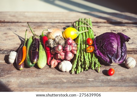 Farm market photo with different vegetables and greens. Organic products and healthy lifestyle photography. Fresh food on the wooden background.
